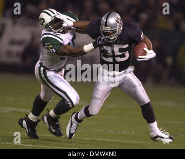 Dec 02, 2002; Oakland, CA, USA; Oakland Raiders' Tim Brown, #81, is tackled  by New York Jets' Donnie Abraham, #29, in the 4th quarter of their game on  Monday, December 2, 2002