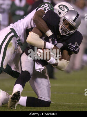 Dec 02, 2002; Oakland, CA, USA; Oakland Raiders' Charles Woodson, tackles  #28 Curtis Martin of the New York Jets'in the 4th quarter of their game on  Monday, December 2, 2002 at Network