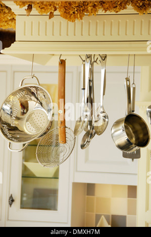 Kitchen utensils hung up in a modern kitchen Stock Photo