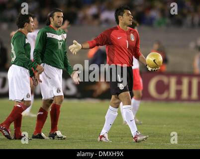 Feb 15, 2006; Los Angeles, CA, USA; SOCCER: Goalie (1) Oswaldo Sanchez of the National Team of Mexico  handles the ball as team mates look on during their tune up match prior to the world cup at the Los Angeles Memorial Coliseum Wednesday 15 February 2006. Korea won the game 1-0. Mandatory Credit: Photo by Armando Arorizo/ZUMA Press. (©) Copyright 2006 by Armando Arorizo Stock Photo