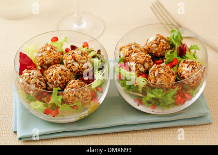 Salad with cheese balls and seeds. Recipe available. Stock Photo
