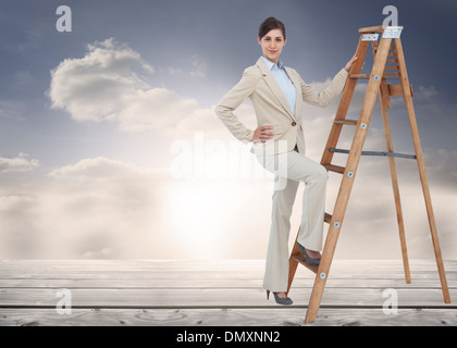 Composite image of smiling businesswoman climbing the career ladder Stock Photo