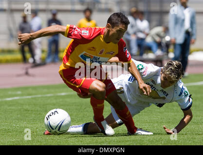 Mar 19, 2006; Mexico City, MEXICO; UNAM Pumas forward Jose Luis Lopez is fouled by UAG Tecos defender Juan Antonio Huerta during their soccer match at the University Stadium in Mexico City. UAG Tecos won 1-0 to UNAM Pumas. Mandatory Credit: Photo by Javier Rodriguez/ZUMA Press. (©) Copyright 2006 by Javier Rodriguez Stock Photo