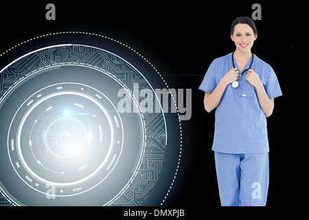 Composite image of smiling medical intern wearing a blue short-sleeve uniform Stock Photo