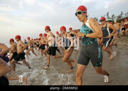 Apr 10, 2006; Boca Raton, FL, USA; Participants in the 2nd Wave enter the water during the 15th Annual Florida Atlantic University Wellness Triathlon in Spanish River Park Sunday morning. Mandatory Credit: Photo by Richard Graulich/Palm Beach Post/ZUMA Press. (©) Copyright 2006 by Palm Beach Post Stock Photo