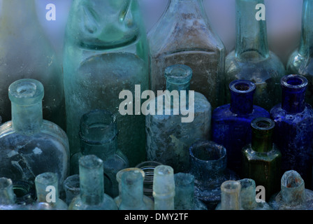 Collection of antique coloured glass bottles Stock Photo