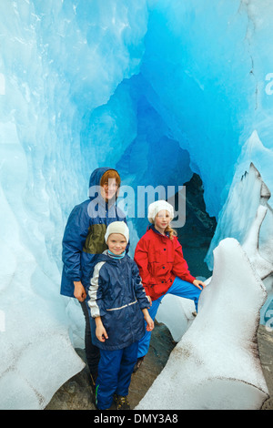 Happy family (mother with two children) near Nigardsbreen glacier (Norway) Stock Photo