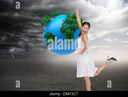 Composite image of happy and classy brunette posing Stock Photo