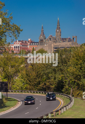 ROSSLYN, VA, USA - Cars on George Washington Memorial Parkway, with Georgetown University Healy Hall in Washington, DC in distan Stock Photo