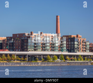 WASHINGTON, DC, USA - Waterfront buildings in Georgetown and elevated Whitehurst Freeway, on Potomac River. Stock Photo
