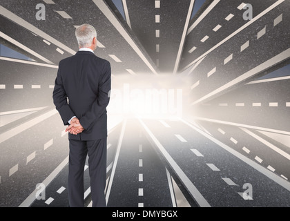 Composite image of rear view of mature businessman posing Stock Photo