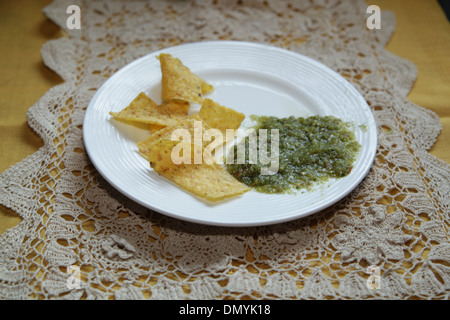 Tortilla chips and Salsa Verde Stock Photo