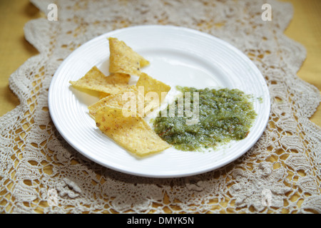 Tortilla chips and Salsa Verde Stock Photo
