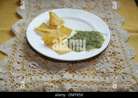 Tortilla chips and Salsa Verde Stock Photo
