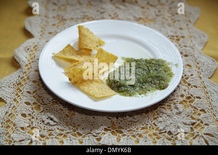 Tortilla chips and Salsa Verde Stock Photo