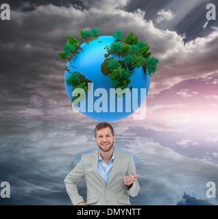 Composite image of stylish man smiling and gesturing Stock Photo