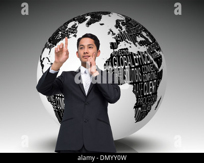 Composite image of thoughtful asian businessman pointing Stock Photo