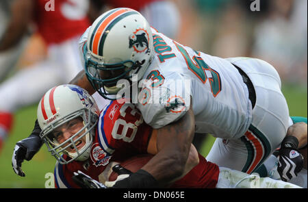 Dec. 06, 2009 - Miami Gardens, Florida, USA - Dolphins-pats-JR120609. Wes Welker of the Patriots gets tackled by Reggie Torbor in the second half. 12/6/09. Sun Sentinel, Jim Rassol  (Credit Image: © Sun-Sentinel/ZUMApress.com) Stock Photo