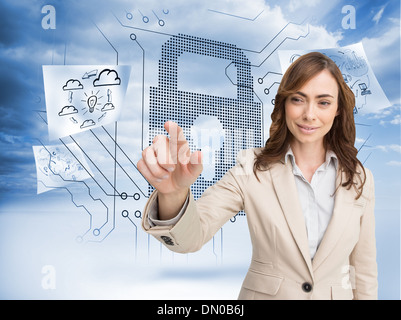 Composite image of portrait of businesswoman touching invisible screen Stock Photo