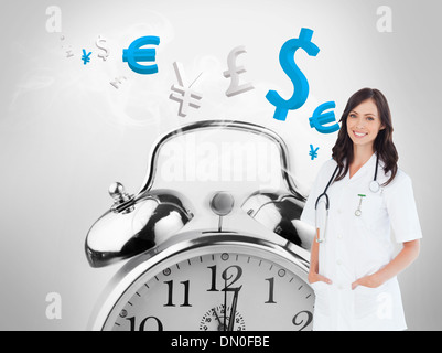 Composite image of confident and smiling woman doctor standing in front of the window Stock Photo