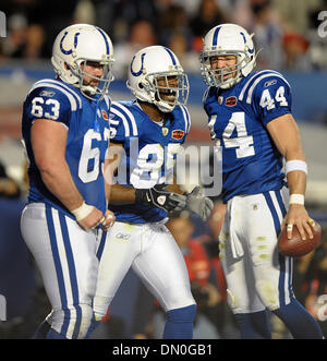 Indianapolis Colt's Dallas Clark (44) is hit by Denver Bronco Anton Palepoi  (95 in the AFC wild card playoff at the RCA Dome in Indianapolis, IN on  January 9, 2005. The Indianapolis