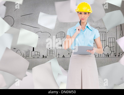 Composite image of thoughtful attractive architect holding clipboard Stock Photo