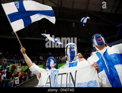 Feb 24, 2010 - Vancouver, British Columbia, Canada - Face painted Finnish fans MARKUS KEKKONEN, HEIKKI MELLA-AHO, and JUSSI KURTTI cheer for their home team during the Men's Hockey game between Finland (FIN) and the Czech Republic (CZE) Wednesday evening in Thunderbird Arena during the 2010 Winter Olympic Games in Vancouver, Canada. Finland defeated Czech 2-0. (Credit Image: © Patr Stock Photo
