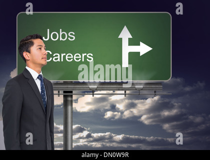 Composite image of signpost showing the direction of jobs and careers Stock Photo