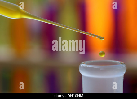 Dropper with falling drop of chemical in a lab Stock Photo
