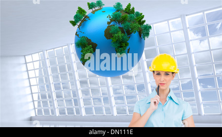 Composite image of thoughtful attractive architect holding clipboard Stock Photo