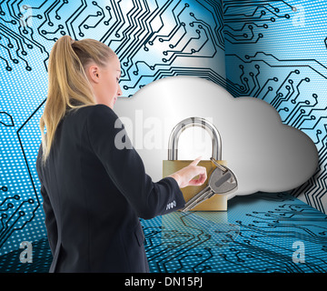 Composite image of businesswoman pointing somewhere Stock Photo