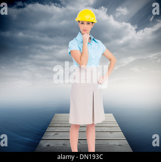 Composite image of thoughtful attractive architect posing Stock Photo