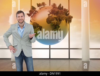 Composite image of stylish man smiling and gesturing Stock Photo