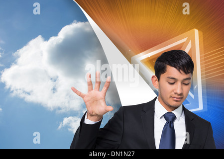 Composite image of unsmiling businessman holding and pointing Stock Photo