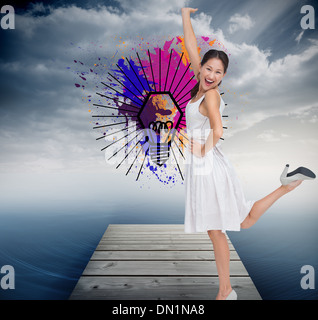 Composite image of happy and classy brunette posing Stock Photo