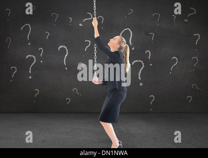 Composite image of businesswoman pulling a chain Stock Photo