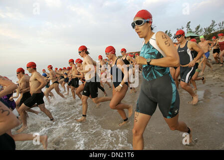 Apr 10, 2006; Boca Raton, FL, USA; Participants in the 2nd Wave enter the water during the 15th Annual Florida Atlantic University Wellness Triathlon in Spanish River Park Sunday morning. Mandatory Credit: Photo by Richard Graulich/Palm Beach Post/ZUMA Press. (©) Copyright 2006 by Palm Beach Post Stock Photo