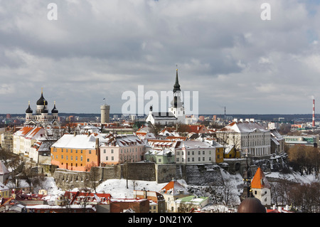 Historic Old Town of Tallinn, capital of Estonia. Roofs of houses are covered with snow. Stock Photo