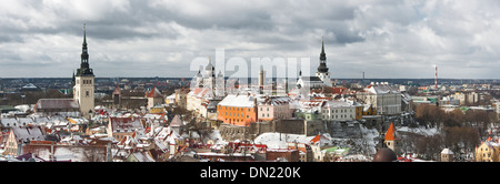 Historic Old Town of Tallinn, capital of Estonia. Roofs of houses are covered with snow. Stock Photo