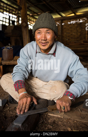 Detail of hands working on sharpening machine tool Stock Photo - Alamy