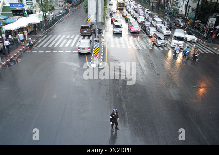 Thai traffic policeman working on street in Bangkok Stock Photo