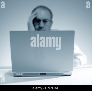 Man working on a laptop Stock Photo