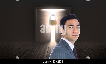 Composite image of unsmiling businessman standing Stock Photo
