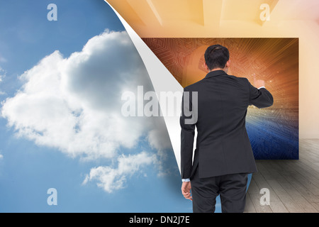 Composite image of asian businessman pointing Stock Photo