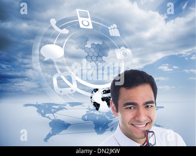 Composite image of smiling businessman holding glasses Stock Photo
