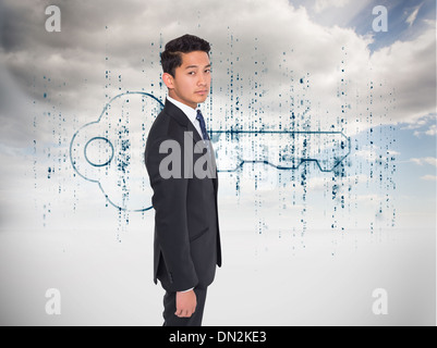 Composite image of serious businessman looking at camera Stock Photo