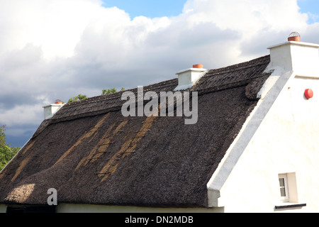 Traditional Old Irish Cottage with a thatched roof in Connemara, Co. Galway, Ireland Stock Photo
