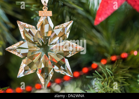 Swarovski 2013 Christmas Star Ornament in decorative setting. Stock Photo