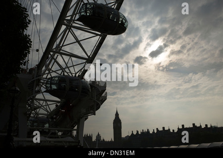 Silhouette of the London Eye and Big Ben in the distance at Westminster, London, UK. Stock Photo