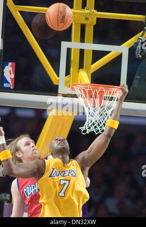 Nov 21, 2006; Los Angeles, CA, USA; Basketball player LAMAR ODOM (7) of the Los Angeles Lakers fails to slam dunk the ball as Los Angeles Clippers player CHRIS KAMAN (35) puts pressure on him   during the first quarter of the game at Staples Center in Los Angeles, CA. The Lakers won the match 105-101. Mandatory Credit: Photo by Armando Arorizo/ZUMA Press. (©) Copyright 2006 by Arma Stock Photo